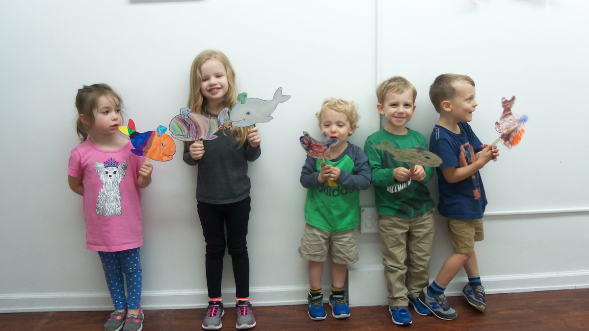 children creating art in Peaceful Frogs class